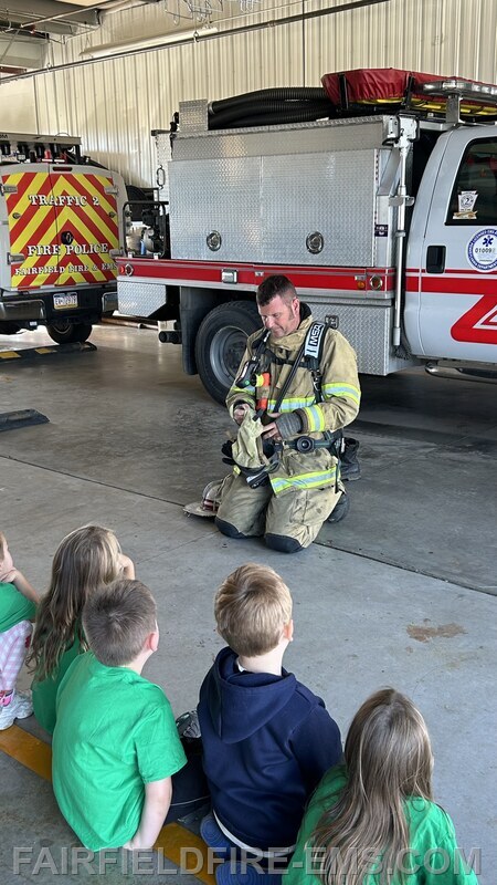 Deputy Chief Jacobs demonstrating the breathing packs.