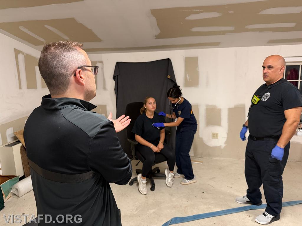 A/C Brian Porco reviewing patient assessment with Lt. Dan Castelhano during the "EMS Call Scenarios" drill