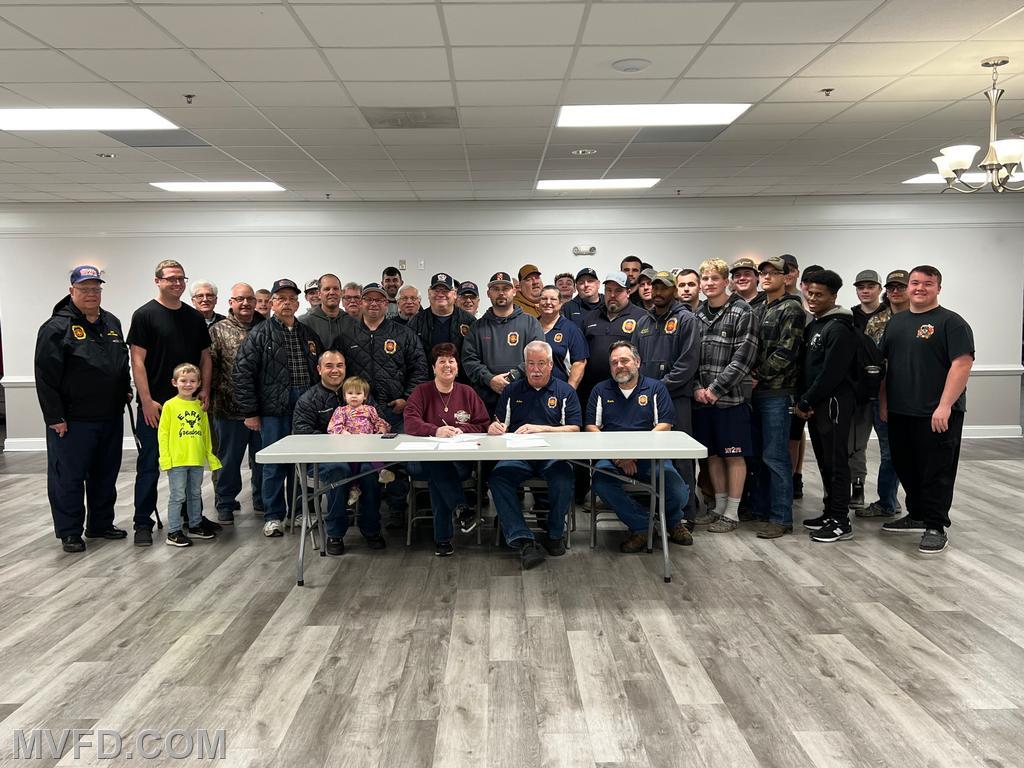 Members witness contract signing for new Tanker