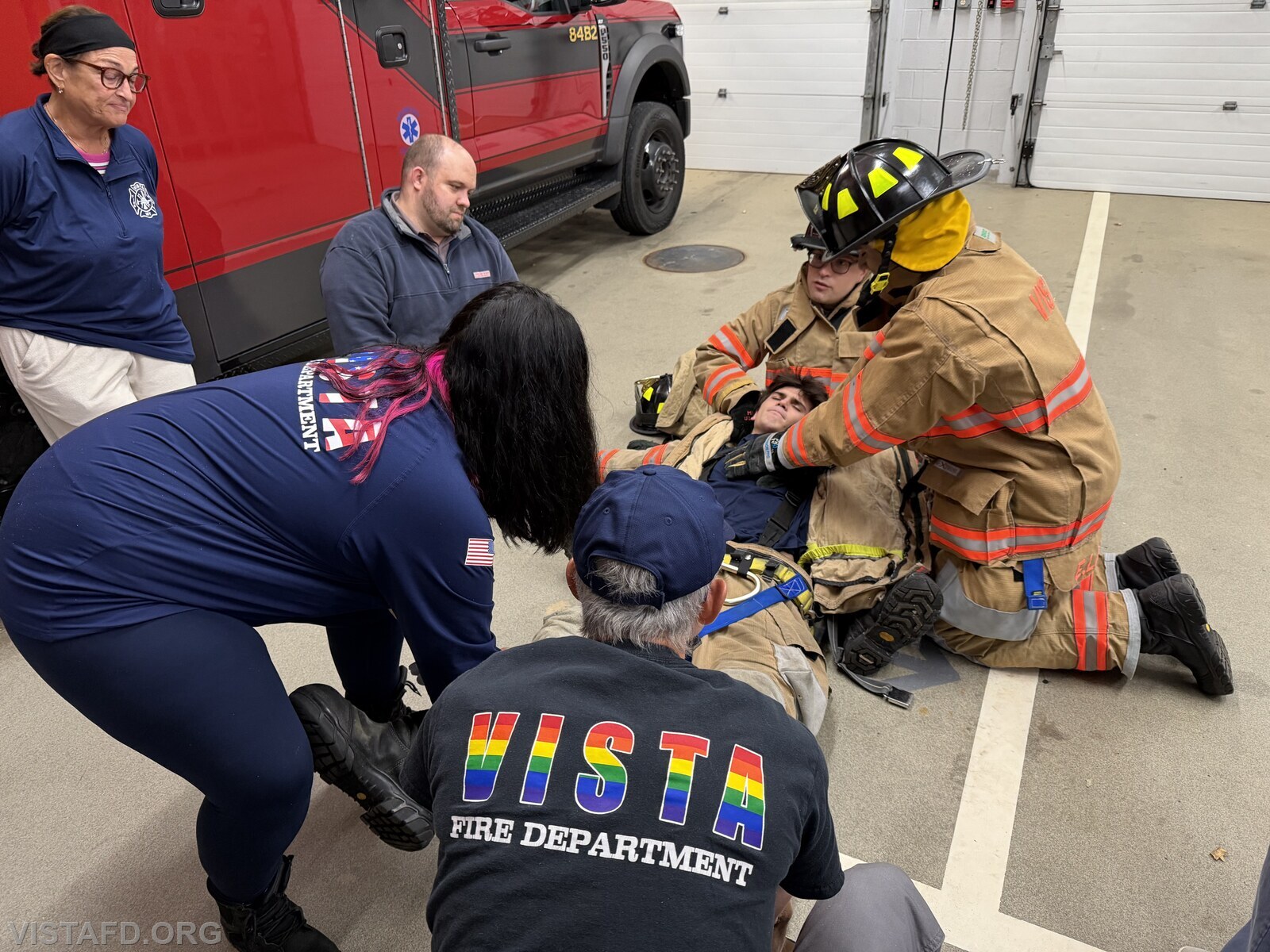 Assistant Chief Brian Porco reviewing how to remove a Firefighter's gear during a medical emergency