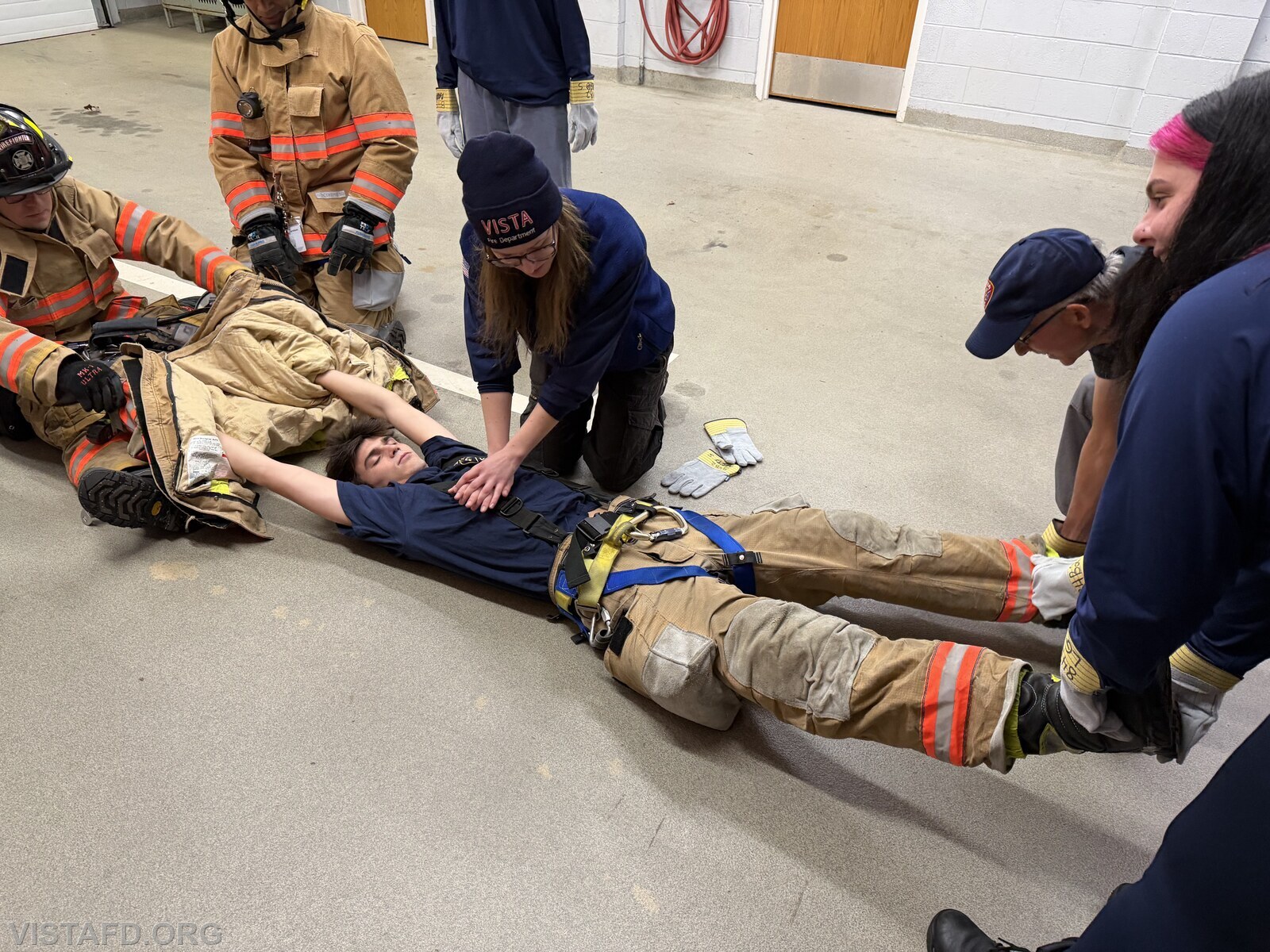 Probationary EMT Olivia Flynn practicing Firefighter CPR