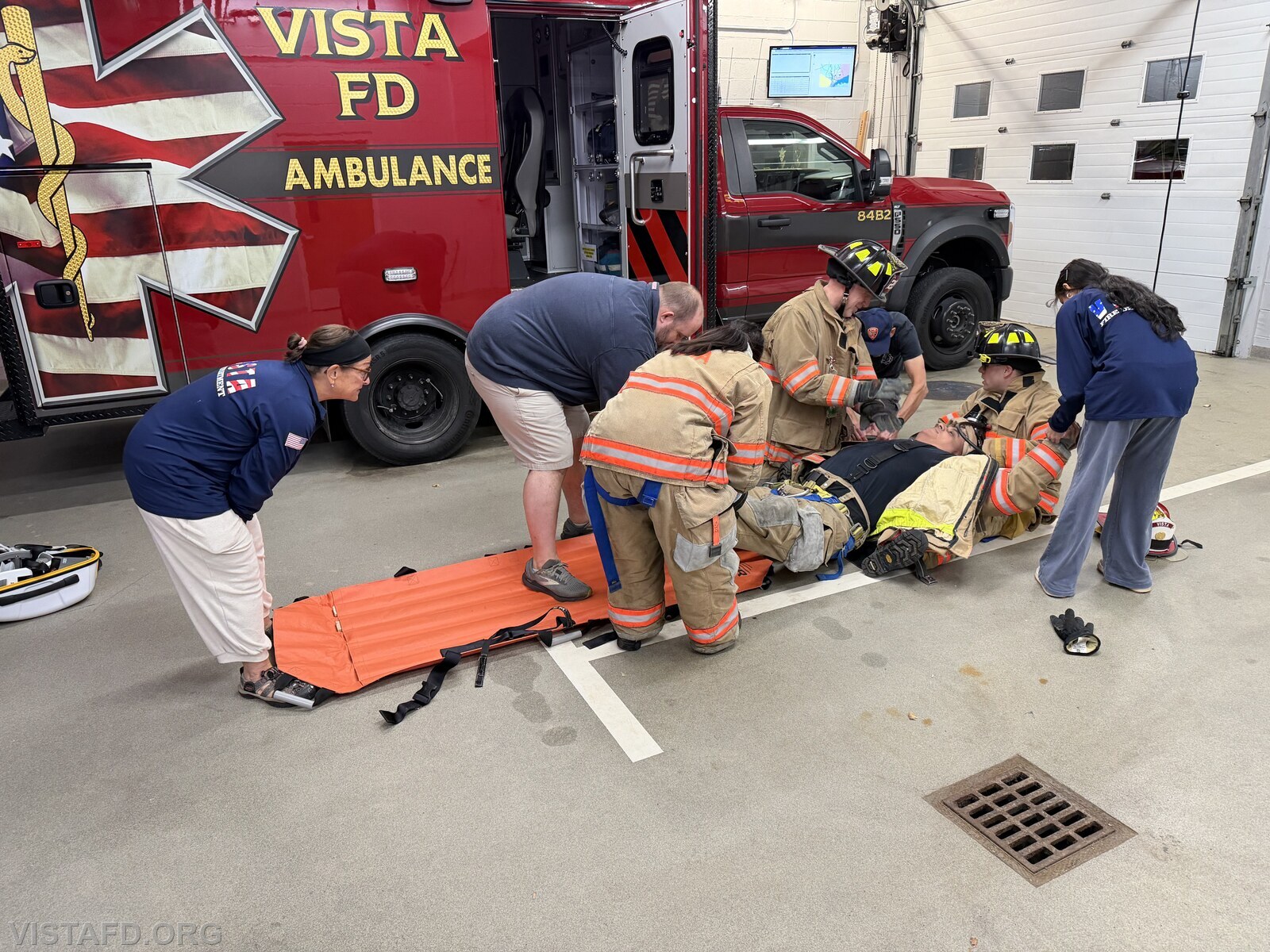 Vista EMS personnel practicing how to package a downed Firefighter