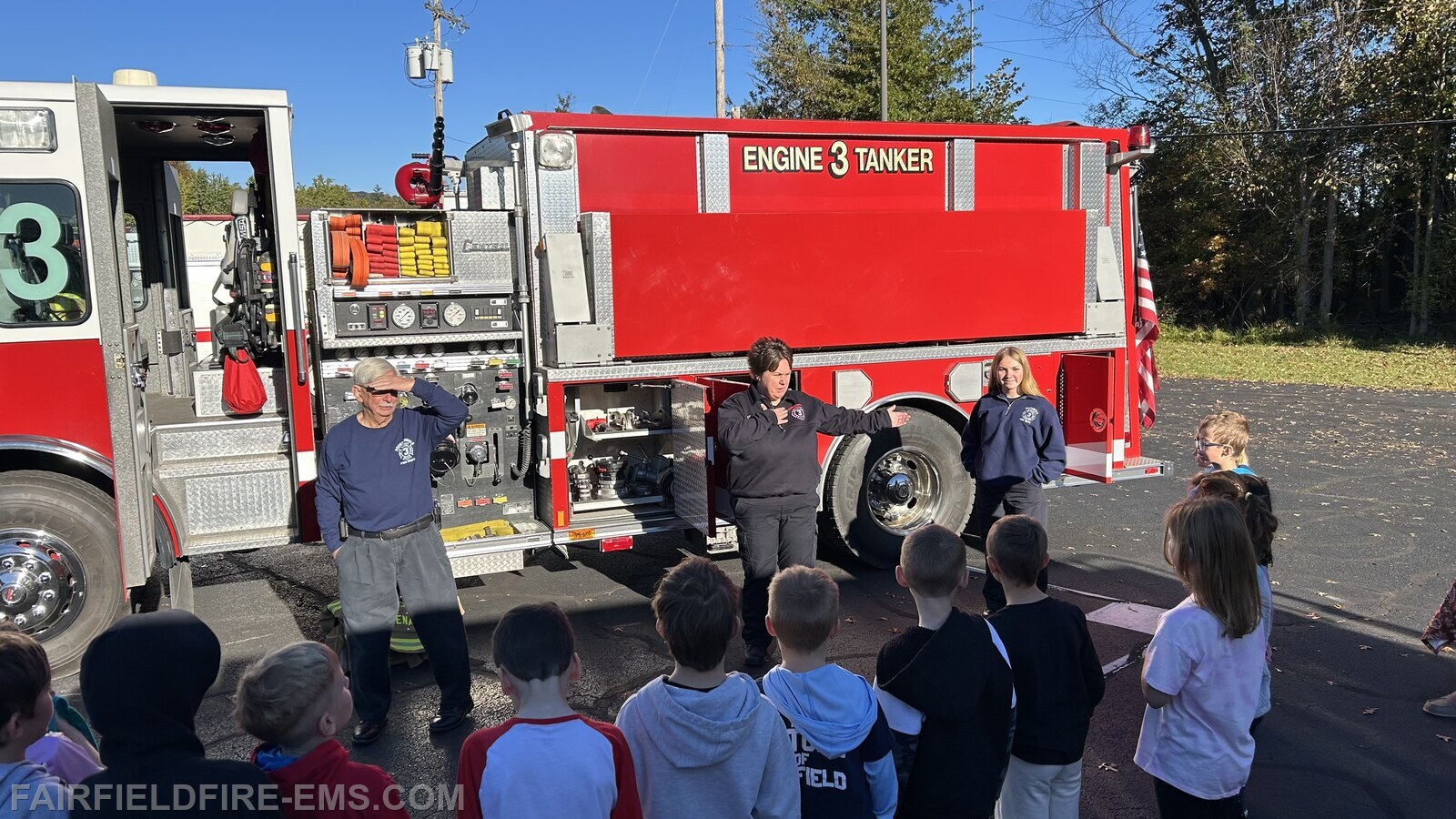 Fountaindale Fire Chief Dave Martin, Lieutenant Sarah Ginn and member Liza Boger talking to the students.