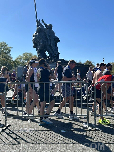 Runners pass near the Marine Corps War Memorial in Arlington, Virginia, during marathon activities.