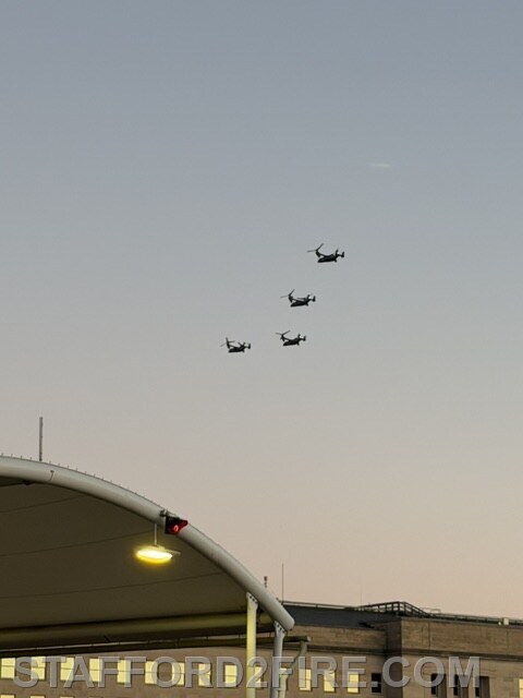 Military aircraft fly over the National Capital Region during Marine Corps Marathon festivities.